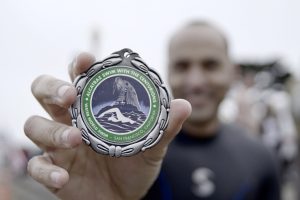Giovanni holding a medal