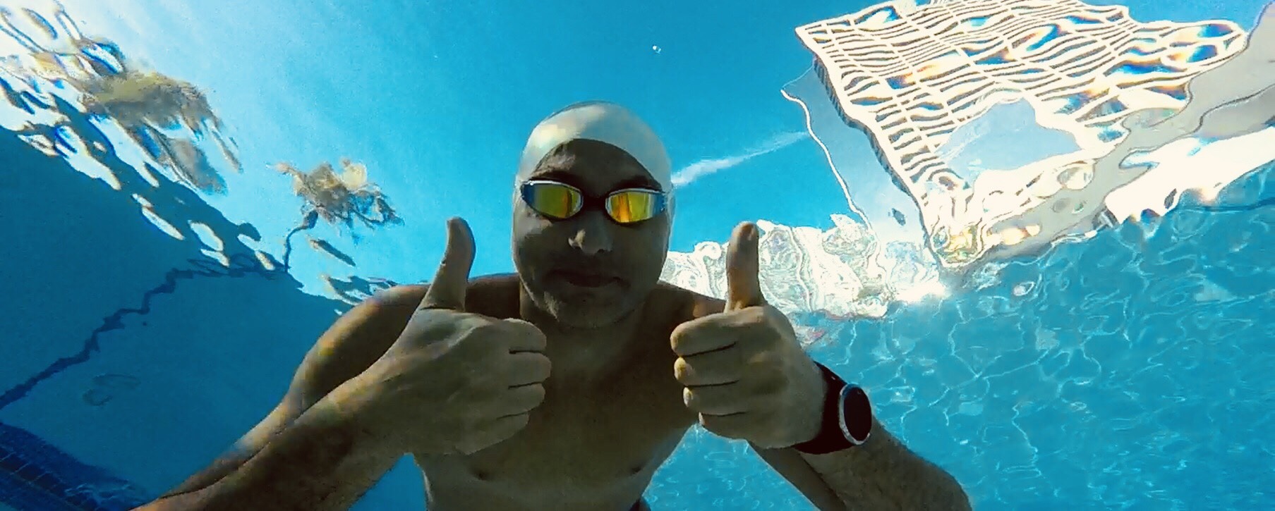Giovanni posing under water